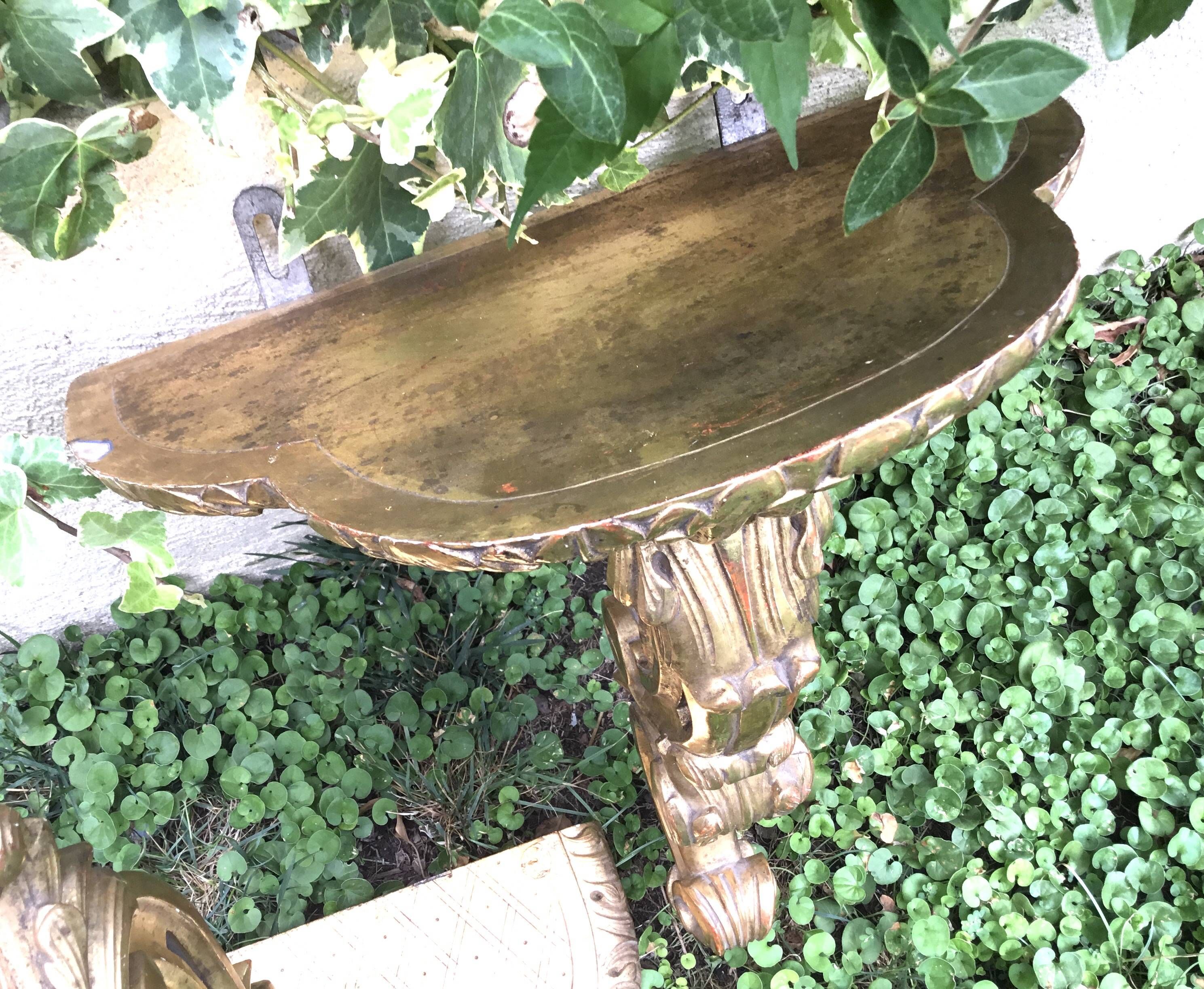 Important, pair of wooden consoles with gilded stucco in Louis XV style. XIX century.