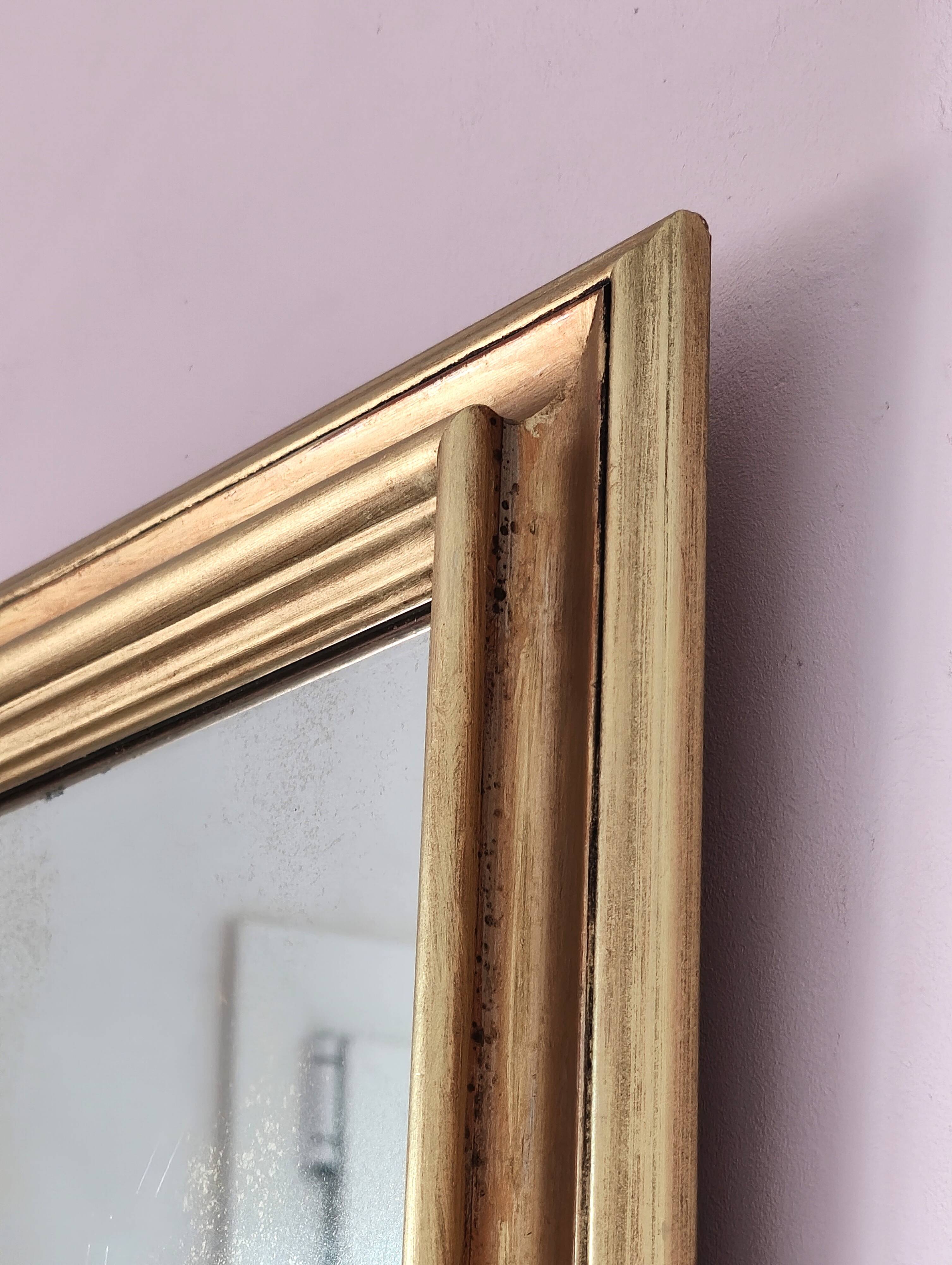 Miroir ancien en bois doré et cuivré