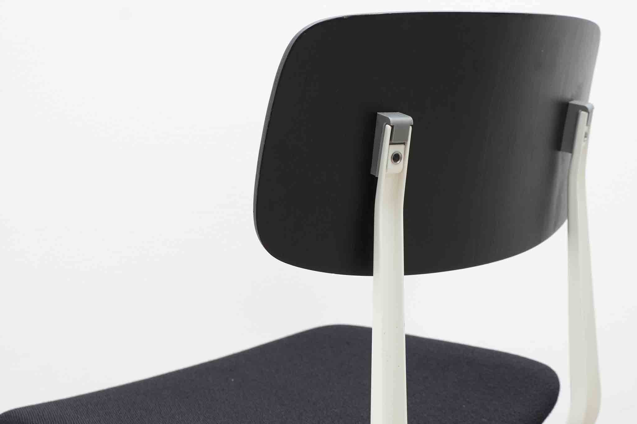Friso Kramer "Result" chair upholstered in black and white.