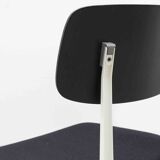 Friso Kramer "Result" chair upholstered in black and white.