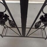 Pink-decorated iron umbrella door.