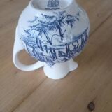 Small old pitcher in iron earth