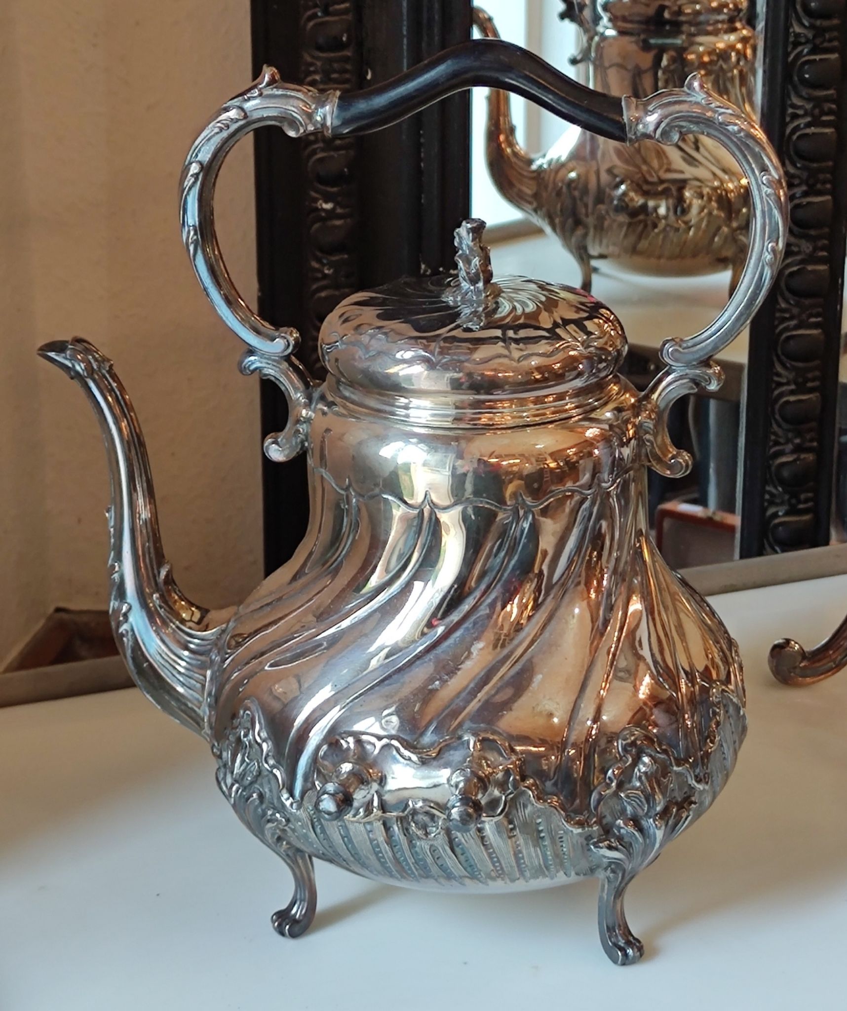 Ancient samovar tea fountain in silver metal