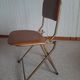 Chaise pliante structure tube et simili cuir
