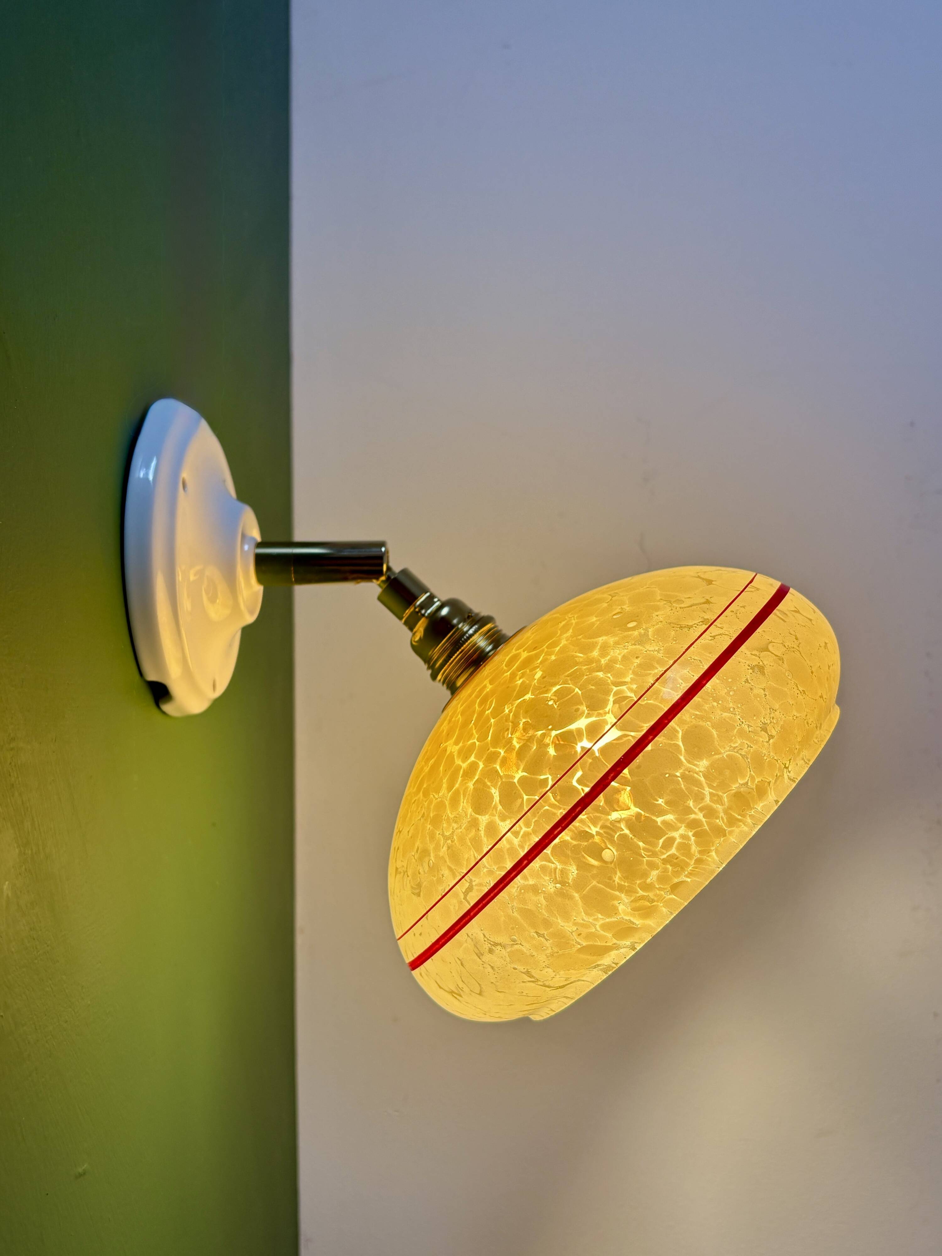 Vintage wall lamp with yellow clichy glass shade and red trim