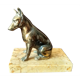 Greenhouse book dog sculpture regulates on marble slab