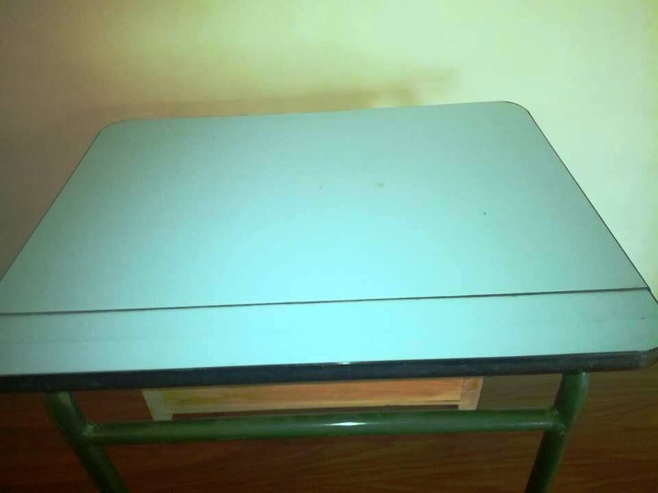 Child in formica desk