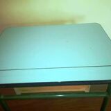 Child in formica desk