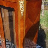 Glass library with rosewood marquetry in the Louis XV style.