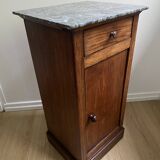 Vintage bedside table in the shape of a wooden column and a gray marble top