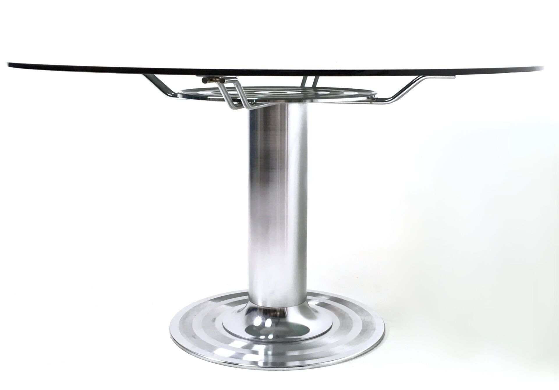 Postmodern chromed metal dining table with a round tempered glass top, italy