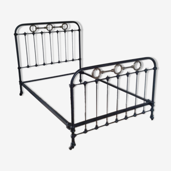 Ancient wrought iron and brass bed