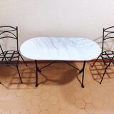 Oval carrara marble table (fixed) and two cast iron chairs