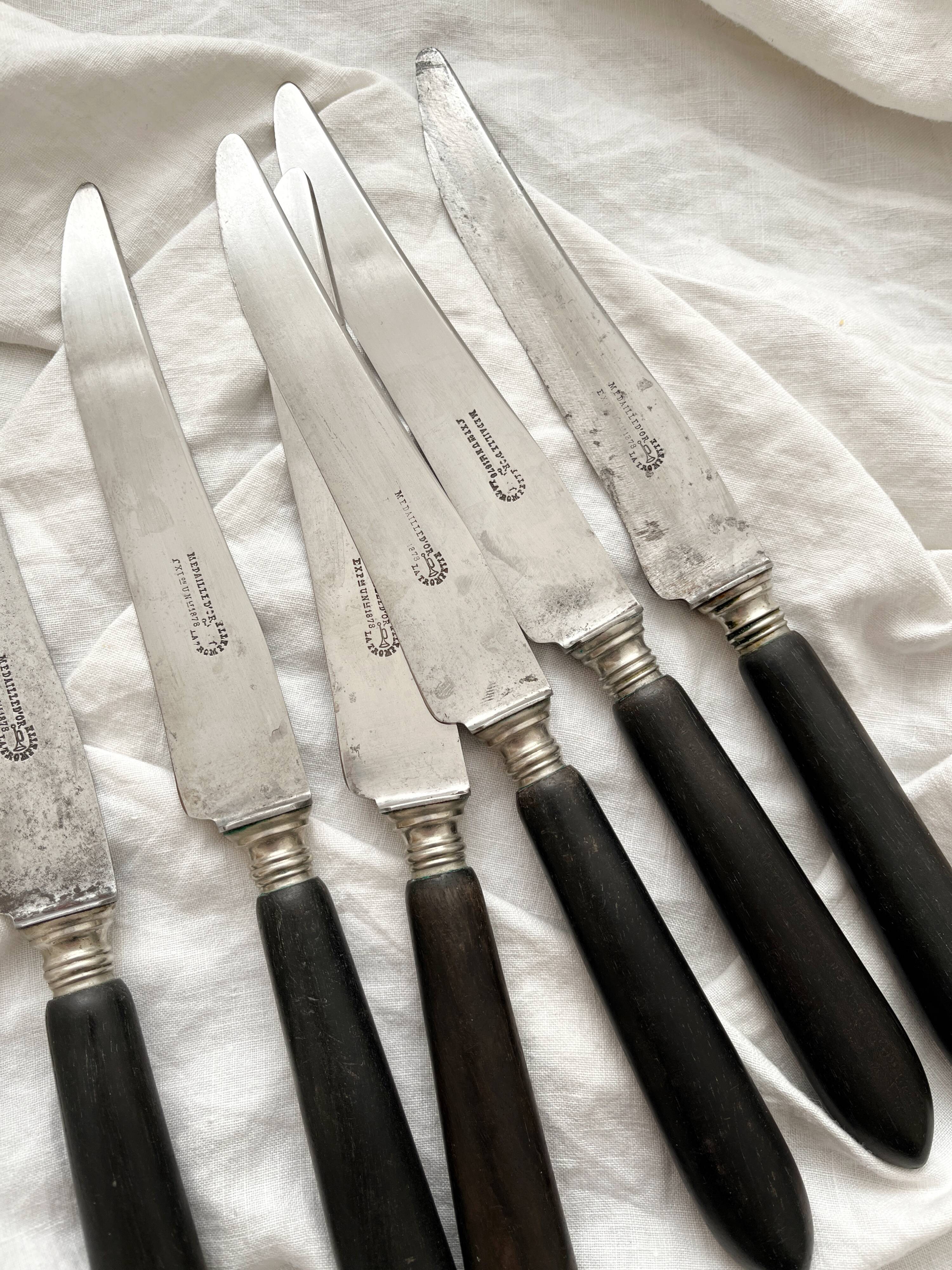 6 antique black wooden table knives La Trompette, late 19th century