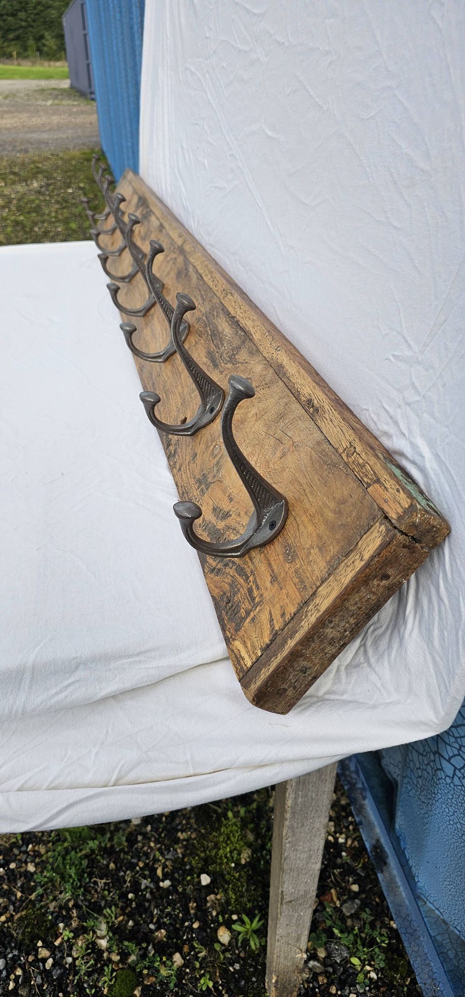 Teak coat rack with 8 double cast iron hooks