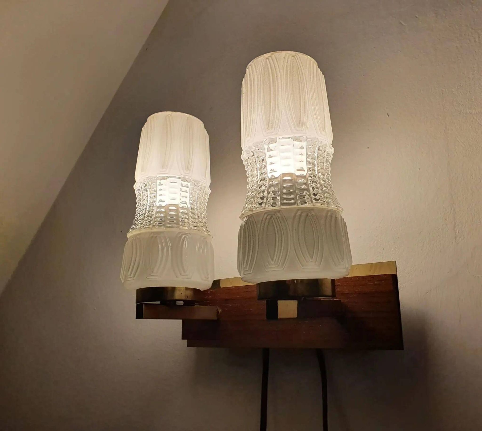 Vintage gold wall light on wooden stand