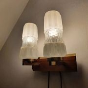 Vintage gold wall light on wooden stand