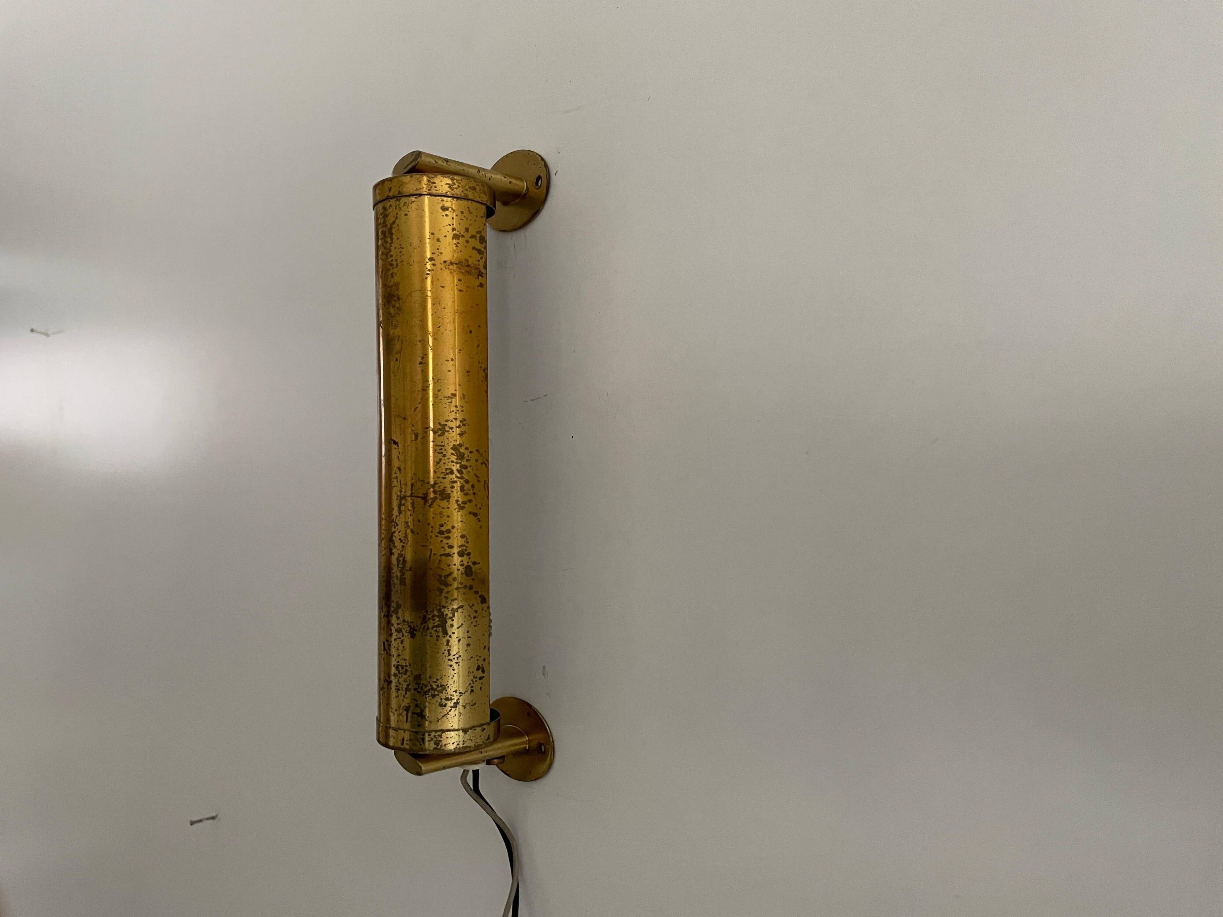 Small simple cylindrical brass wall light from the mid-century, 1950s, Germany.