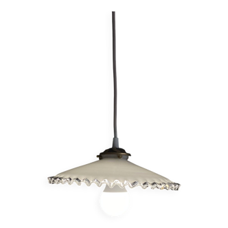 Old lampshade in white opaline glass with a wavy edge.