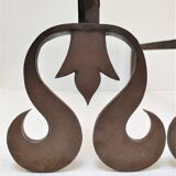 Pair of sculptural cast iron chenets with twisted heads