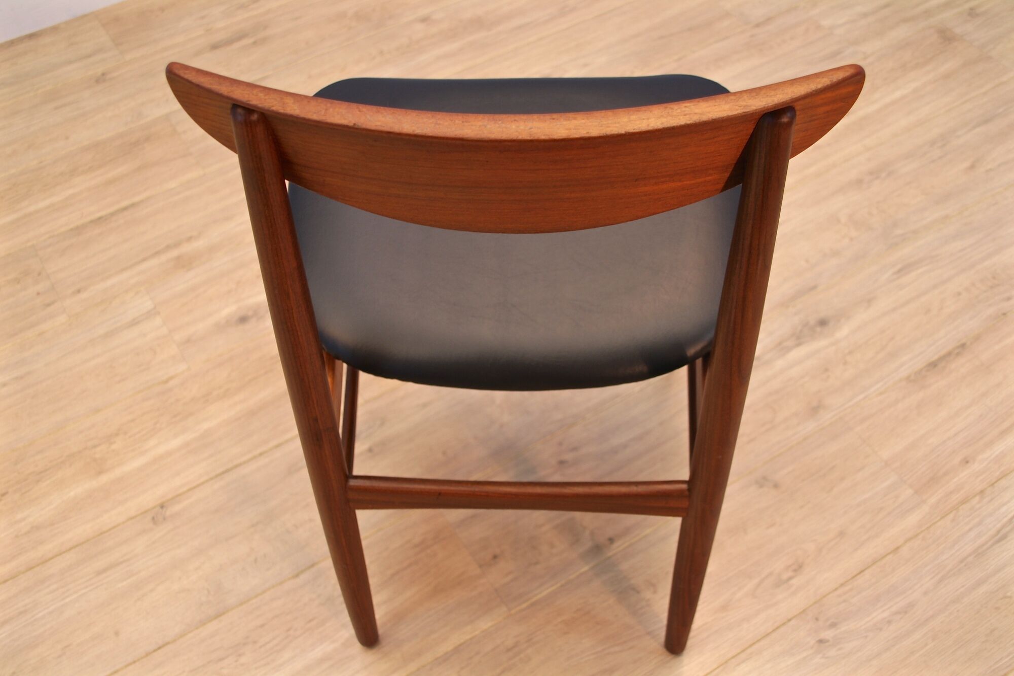 Danish dining chair in teak with new upholstery in black leatherette, 1960s