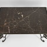 Coffee table in patinated wrought iron and black marble, circa 1940