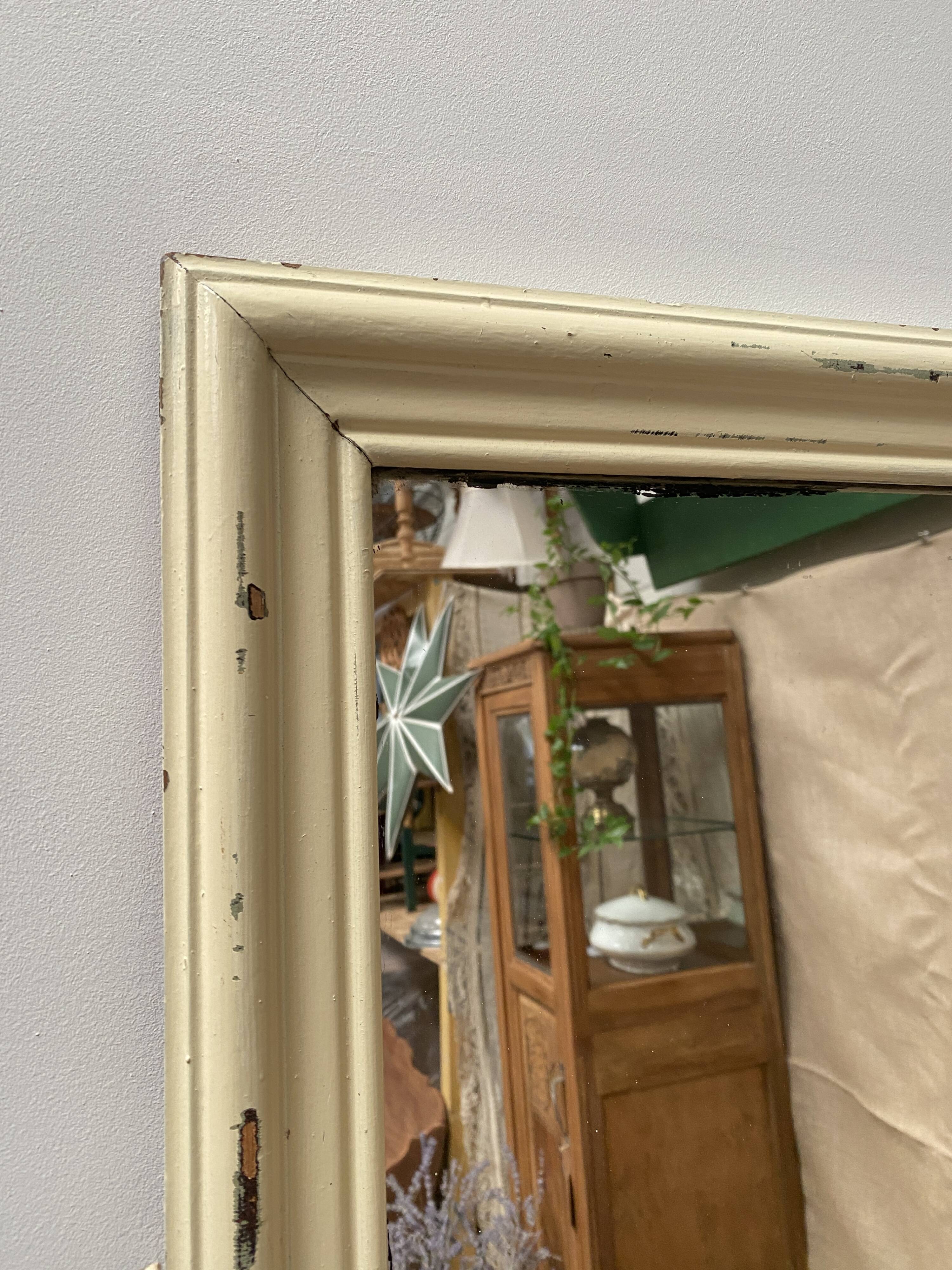 Antique mirror with beige patina
