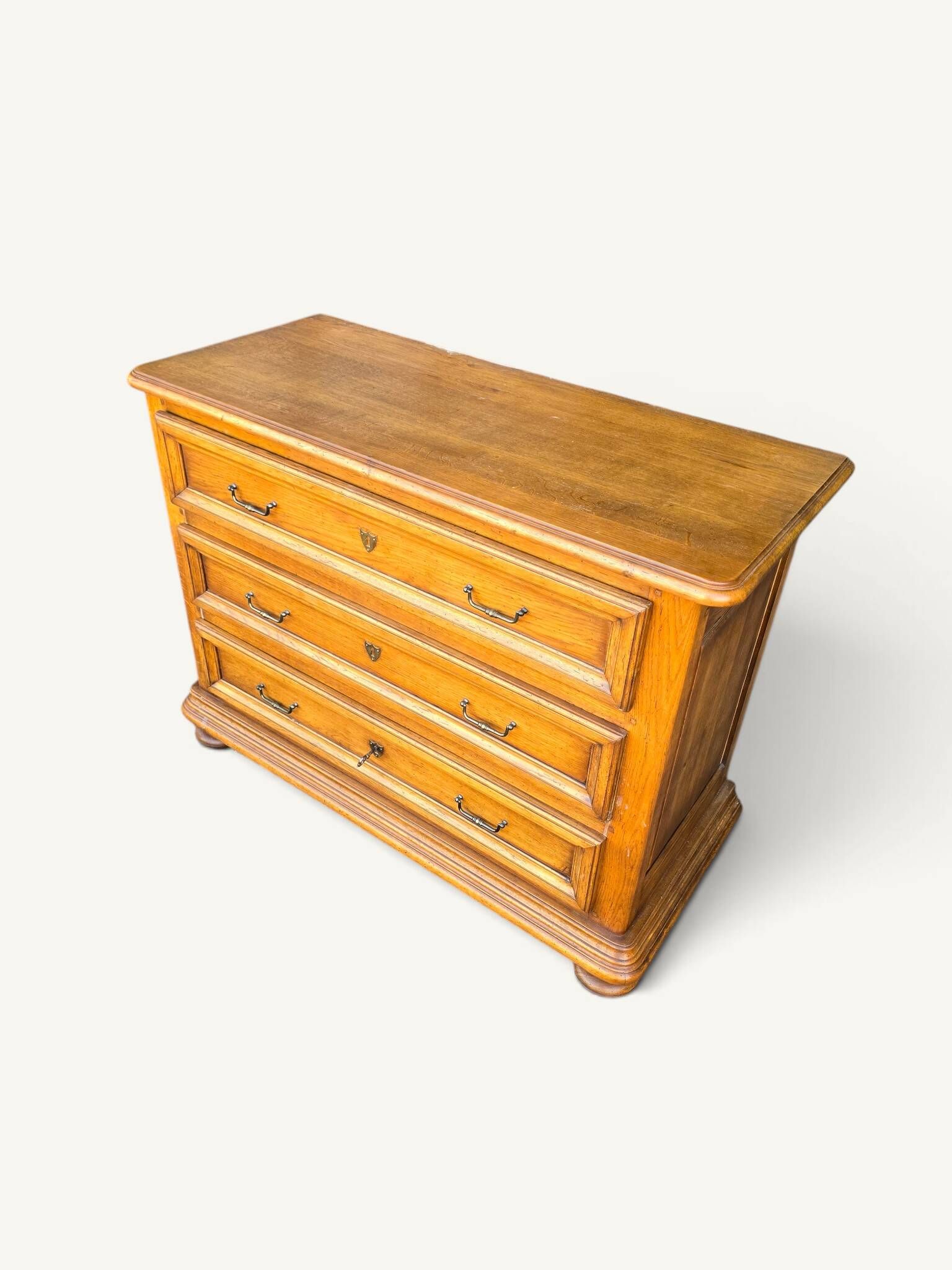 Antique oak chest of drawers with three drawers in Louis XIII style.