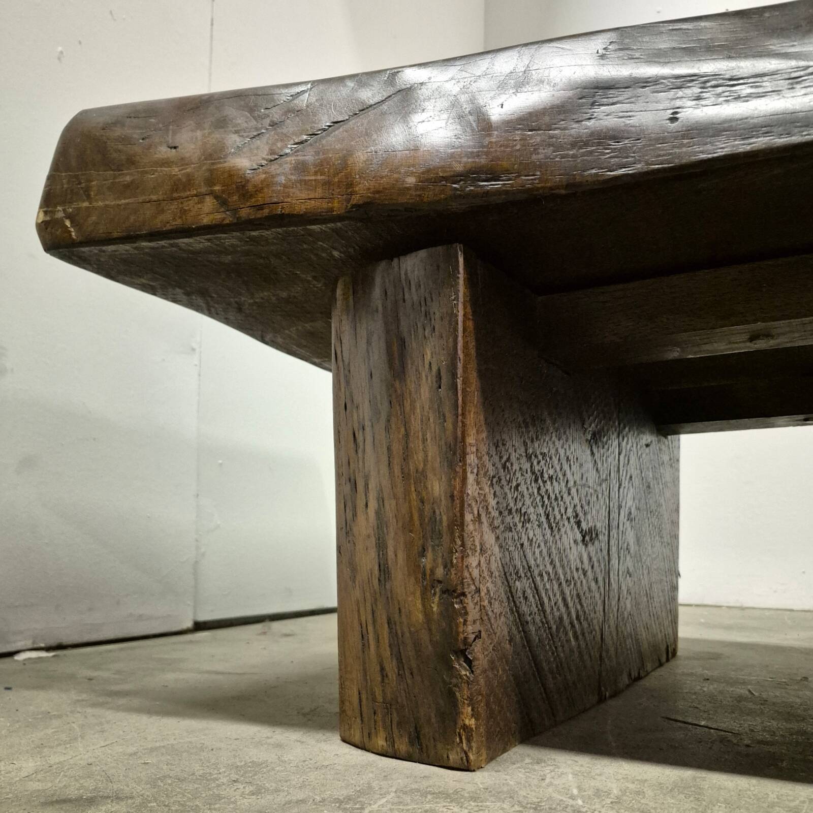 Rustic solid oak coffee table with a one piece top, France 1950s