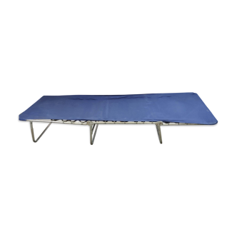 Metal camp bed and blue cloth