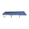 Metal camp bed and blue cloth