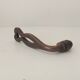 Antique wrought iron door handle with chiselled design.
