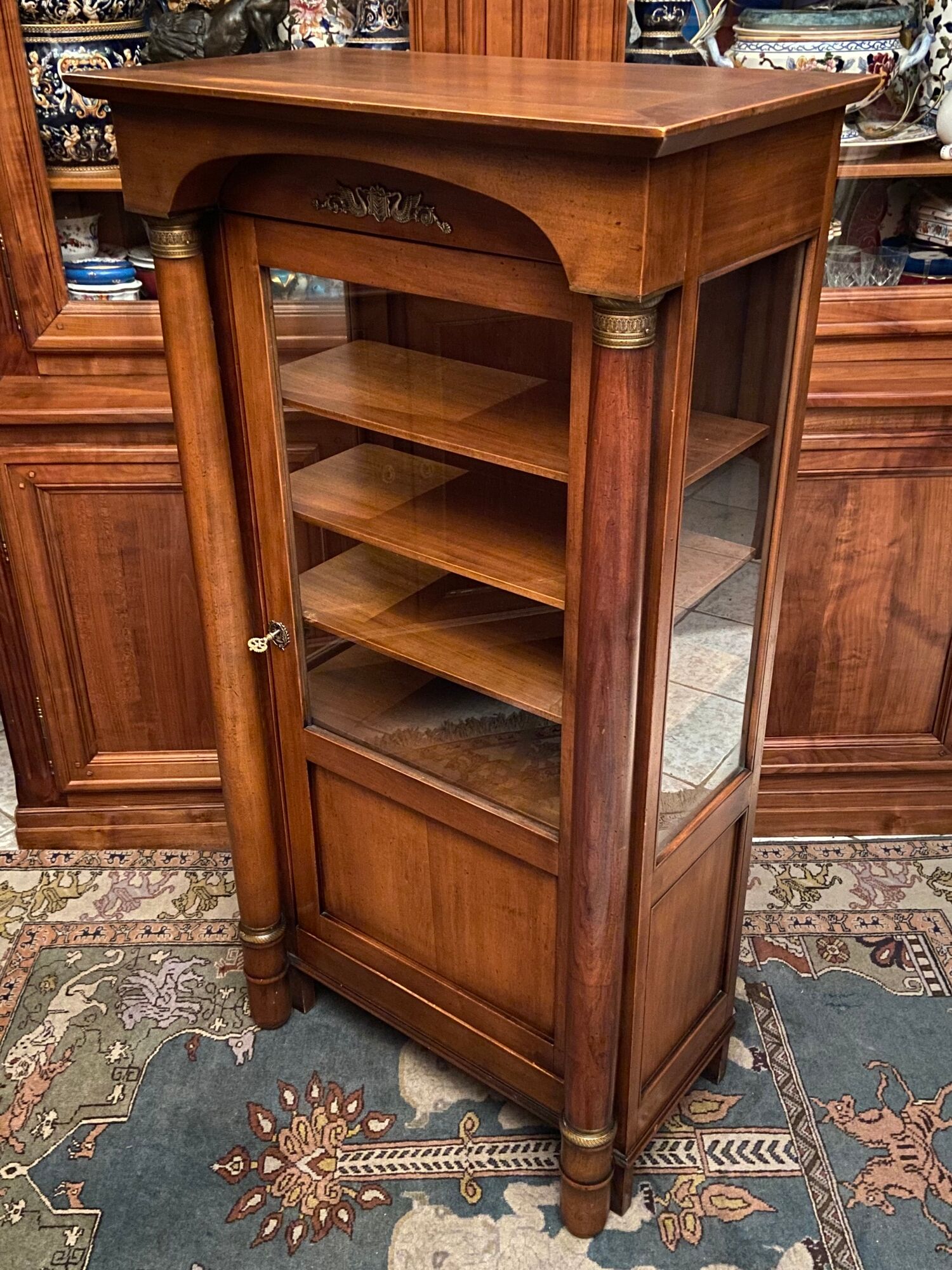 Empire style display case in cherry wood