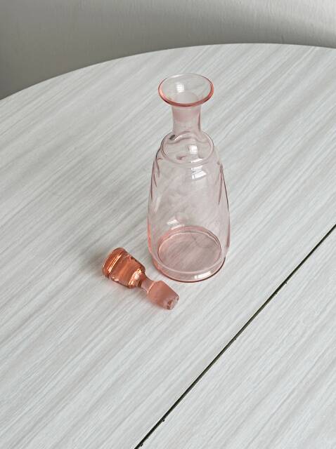 Antique translucent pink glass bottle
