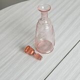 Antique translucent pink glass bottle
