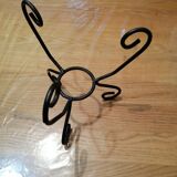Glass vase on vintage wrought iron feet