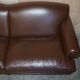 Contemporary Howard & Sons style grand sofa with brass casters.