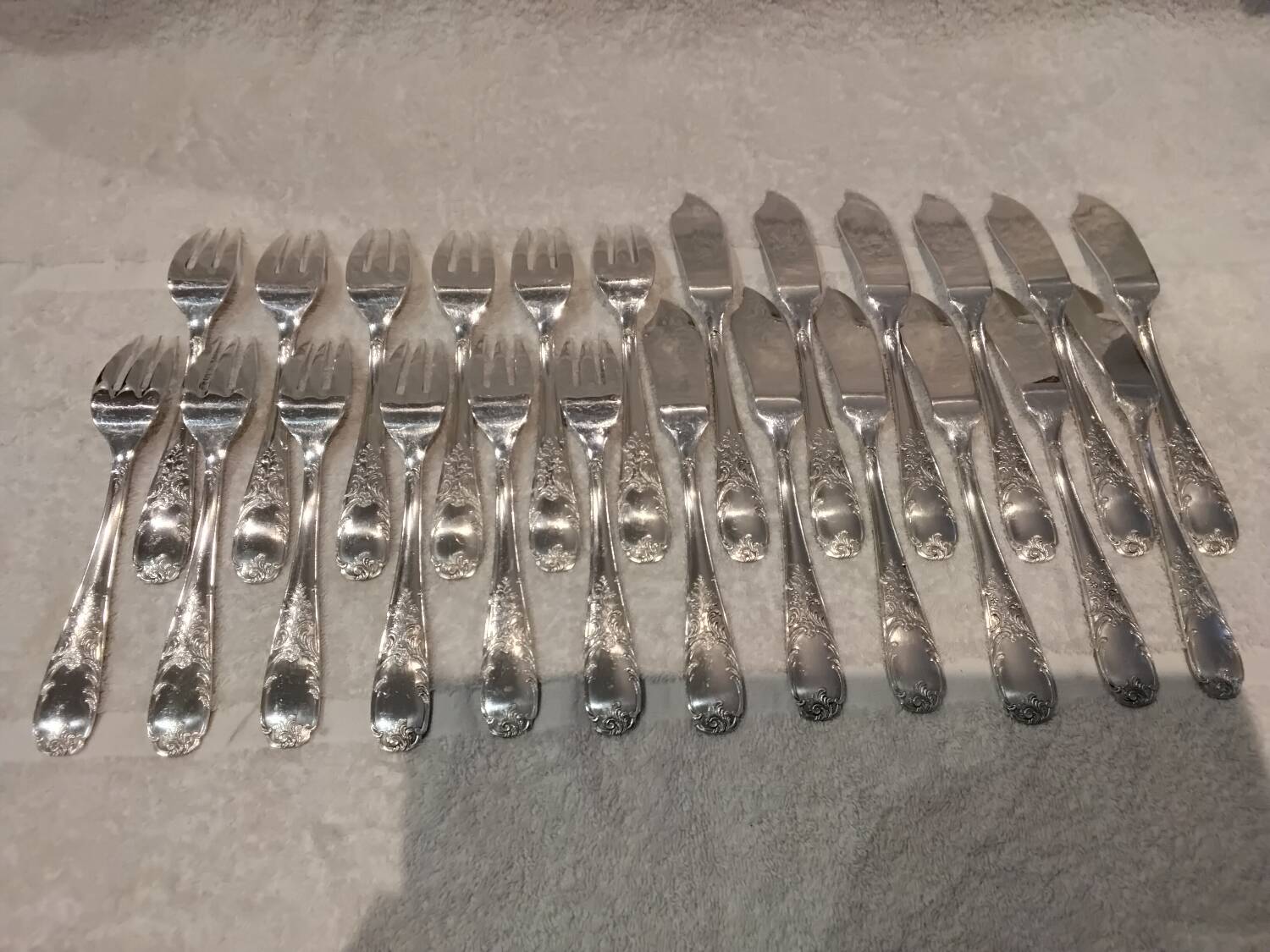 12 forks, 12 fish knives, silver-plated metal, rocaille pattern