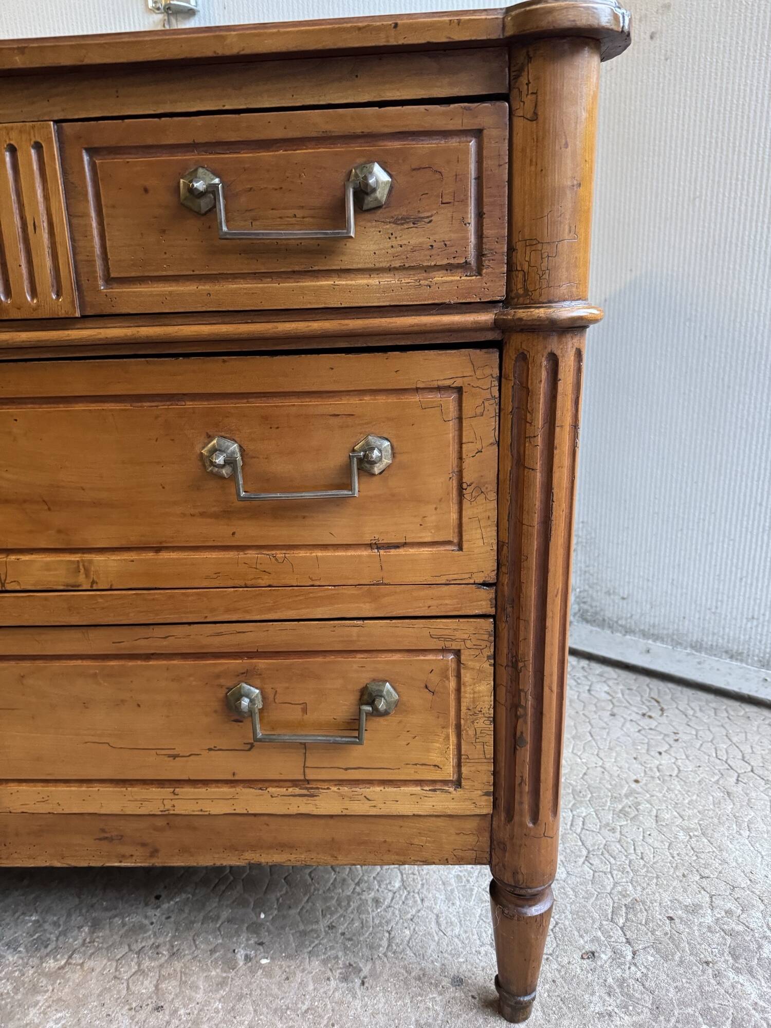18th-century antique chest of drawers from the Louis XVI period in blonde walnut.