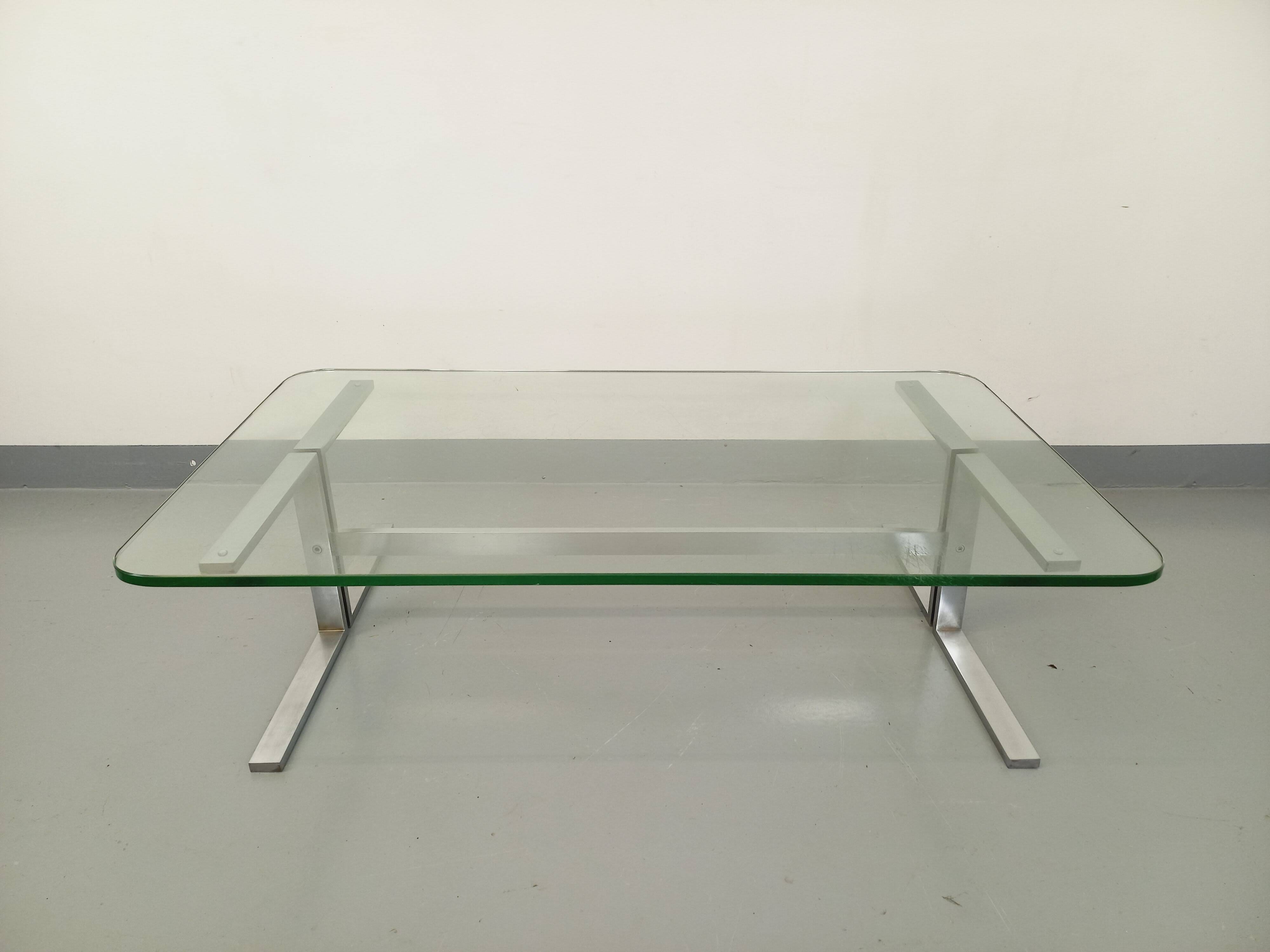 Vintage coffee table in transparent glass and cast aluminum from the 70s