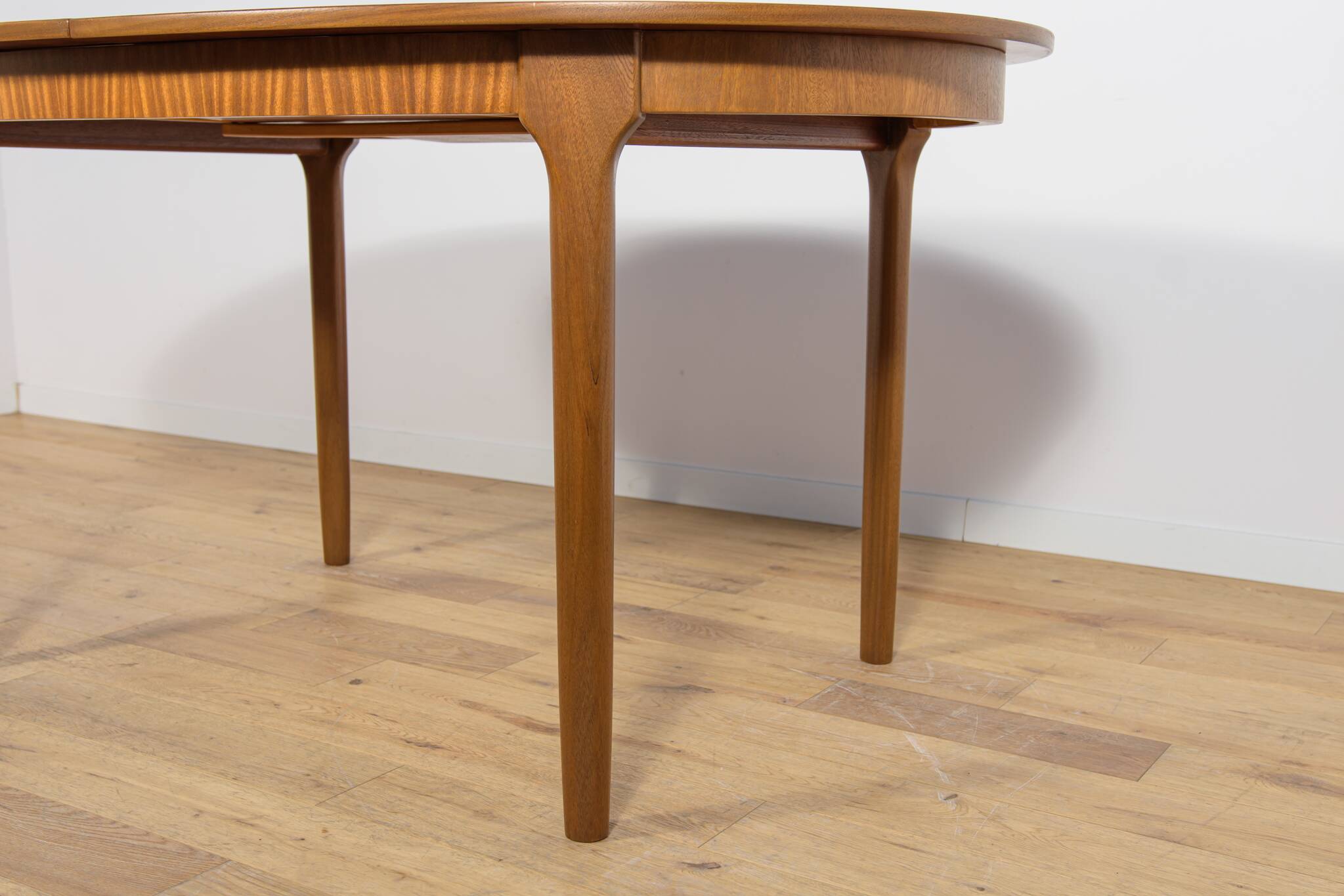 Mid-century extendable oval teak dining table from McIntosh, UK
