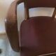 Skai chair binds wine and wooden footpieces and armrests