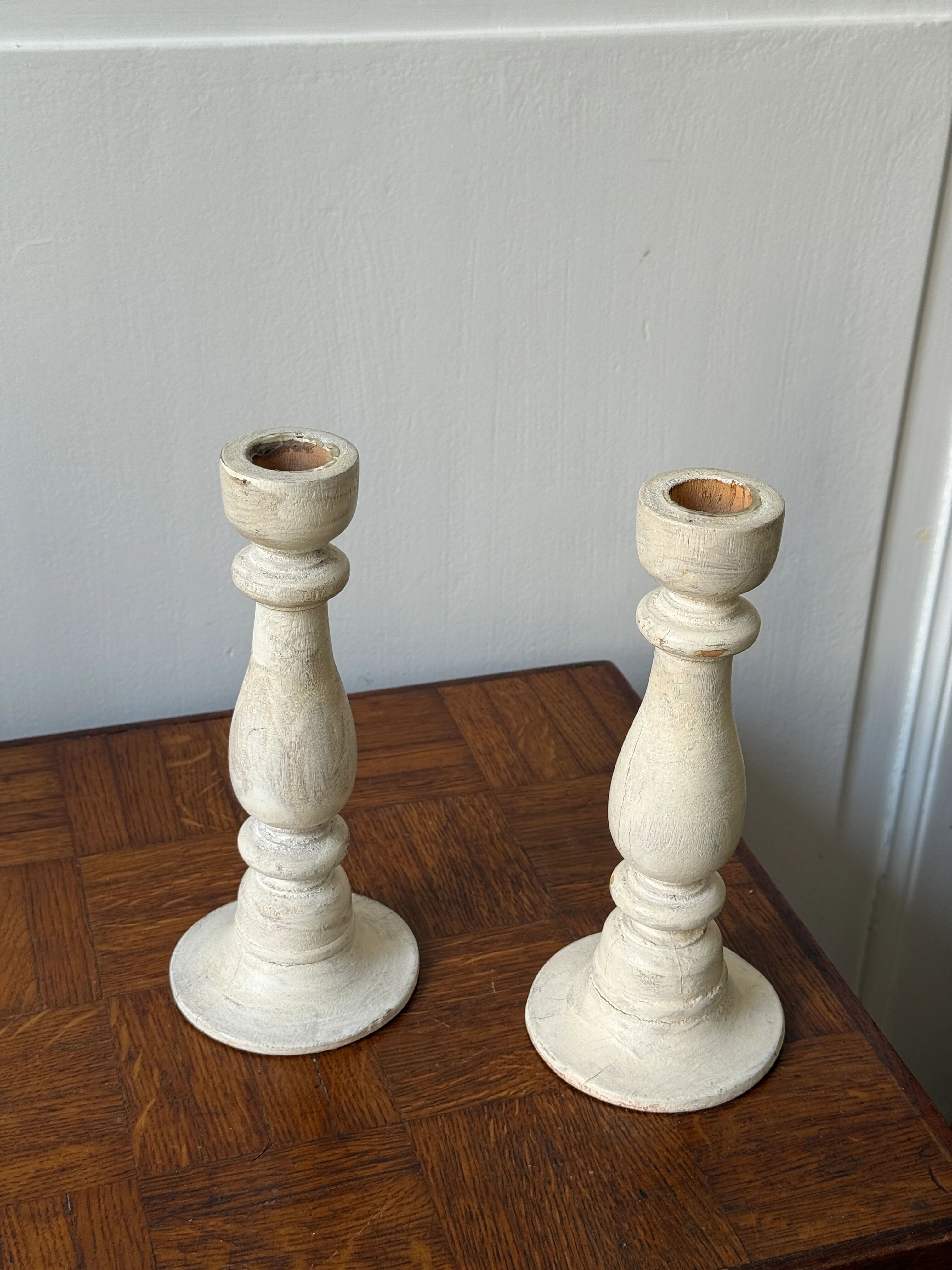 Pair of white wooden candlesticks