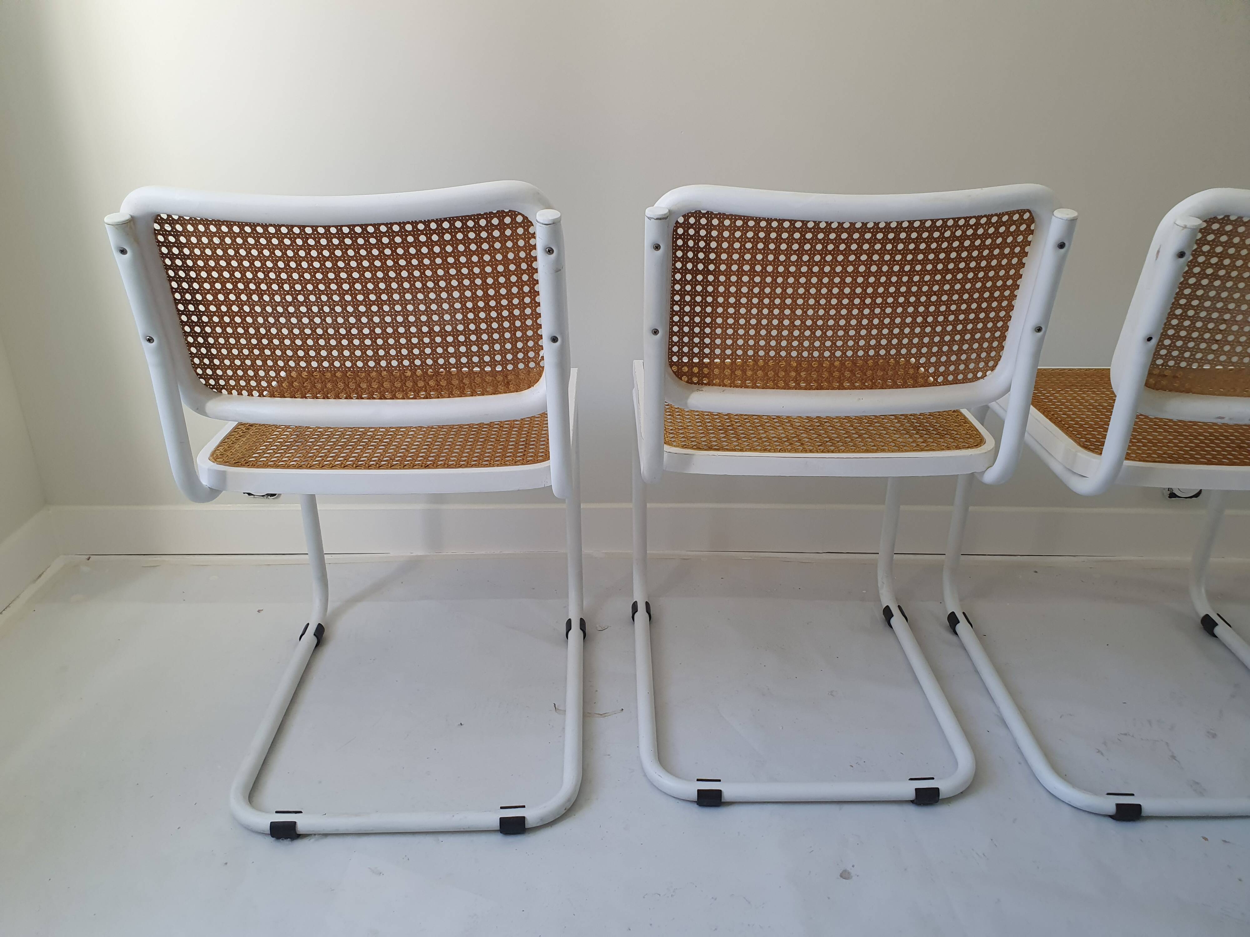 B32 chairs by Marcel Breuer in white.
