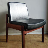 Massive teak and black skai armchair from the 1960s