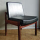 Massive teak and black skai armchair from the 1960s