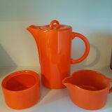 Coffee pot has orange 1970 sugar milk