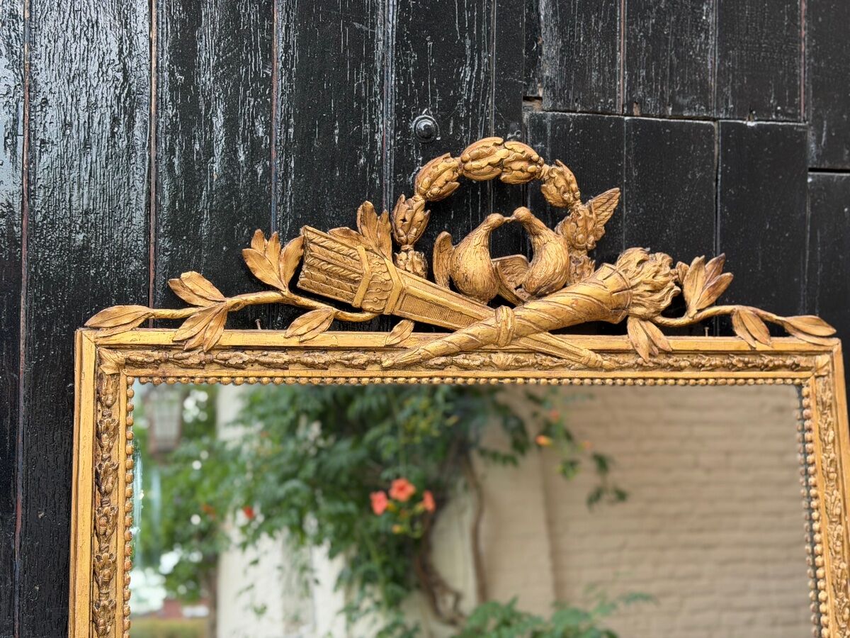 Louis XVI mirror in carved and gilded wood, 18th century