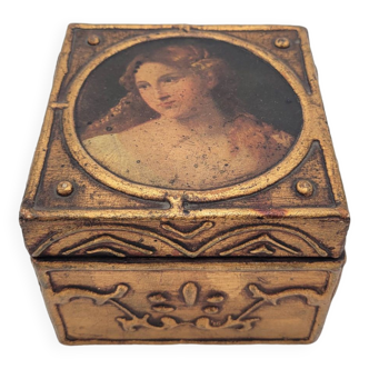 Old jewelry box in wood and gilded stucco