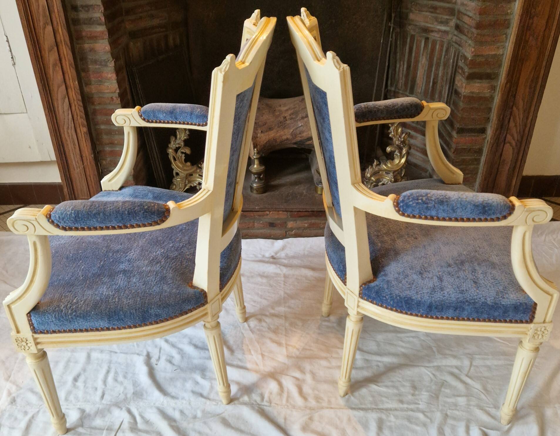 Pair of Louis XVI cabriolet armchairs in cream and blue French elegance late 19th century